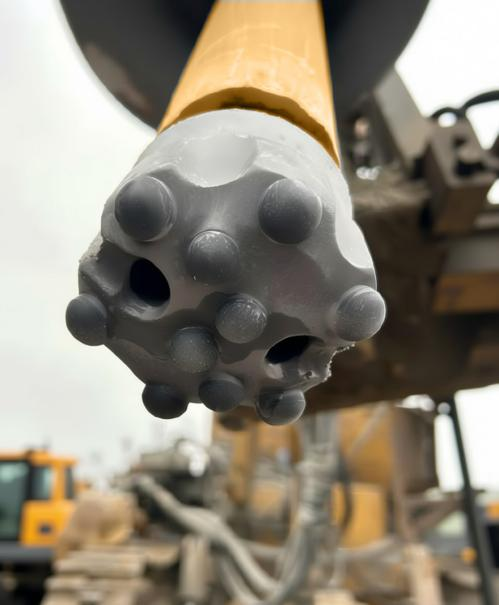 Performance Test of a New Hammer Bit with PDC C...